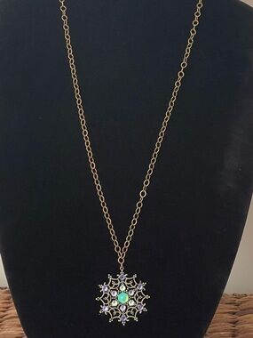Gold-Tone Filigree Starburst, snowflake Pendant Necklace with Green Center Stone